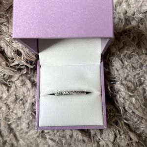 Brand new, never worn diamond wedding band in white gold.